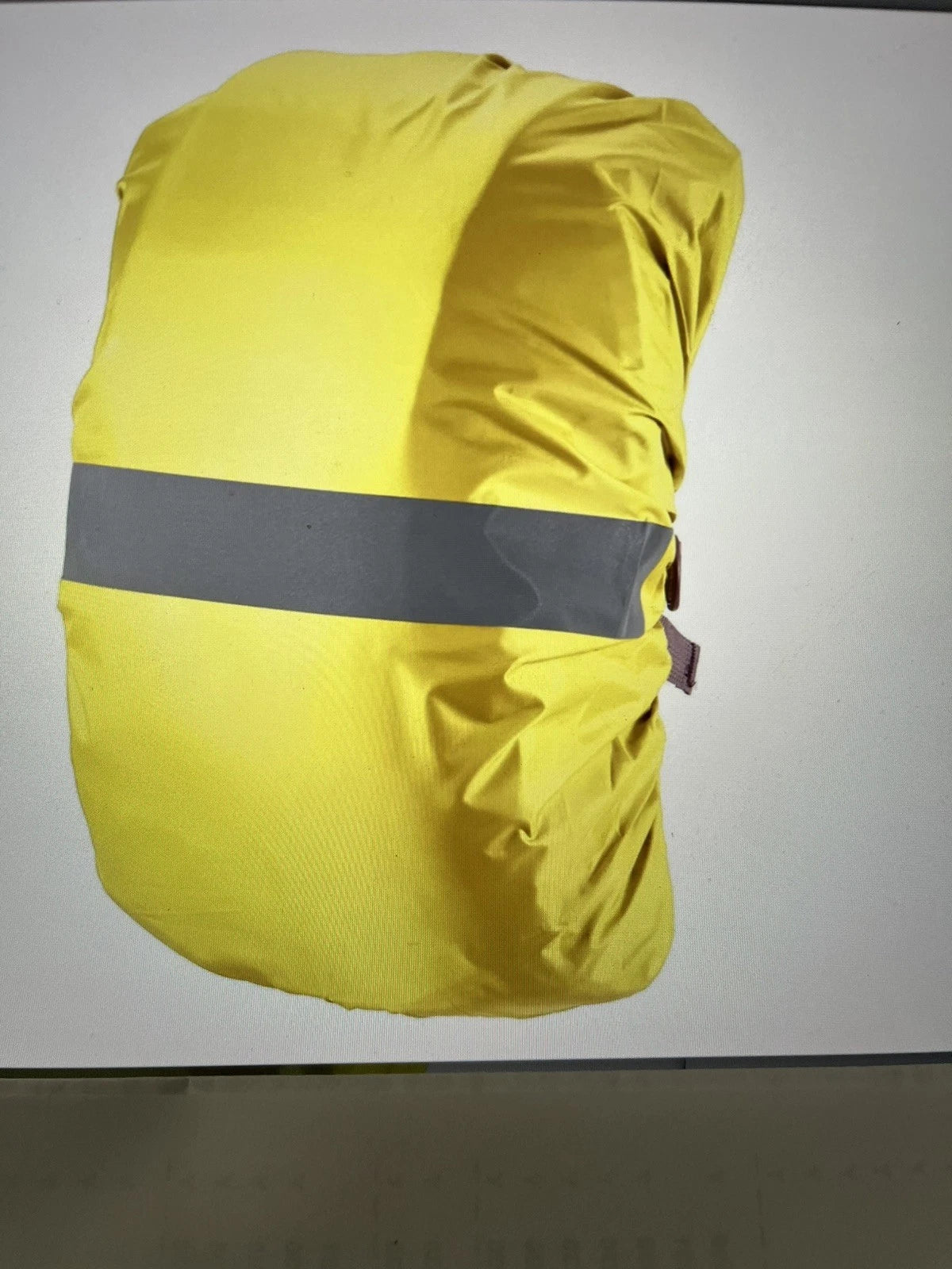 Yellow reflective rain cover for a 40 liter backpack